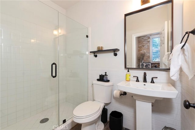 27014 Monterey Ave, Valencia, CA 91355 - bathroom featuring a stall shower, toilet, and tile walls