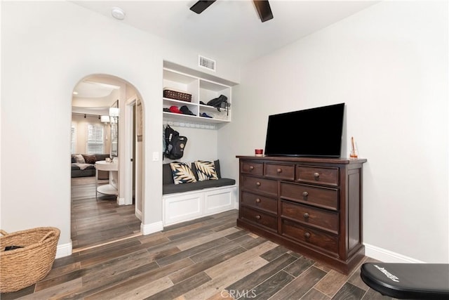 27014 Monterey Ave, Valencia, CA 91355 - bedroom featuring arched walkways, dark wood-type flooring, baseboards, and a ceiling fan