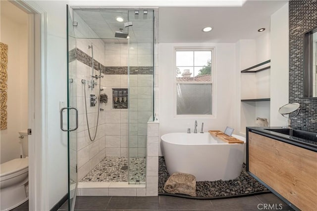 27014 Monterey Ave, Valencia, CA 91355 - full bathroom featuring toilet, a stall shower, a freestanding tub, and recessed lighting