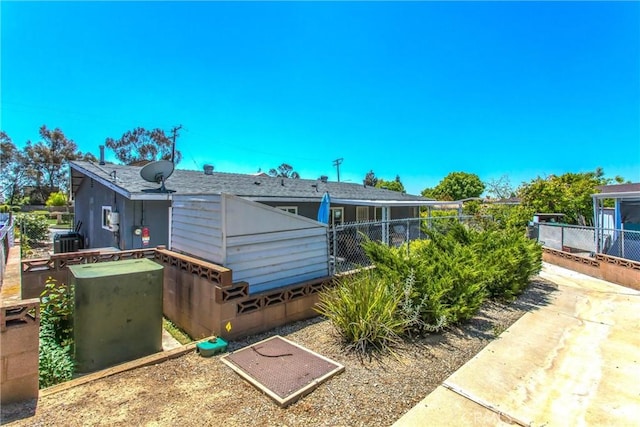 rear view of house with fence