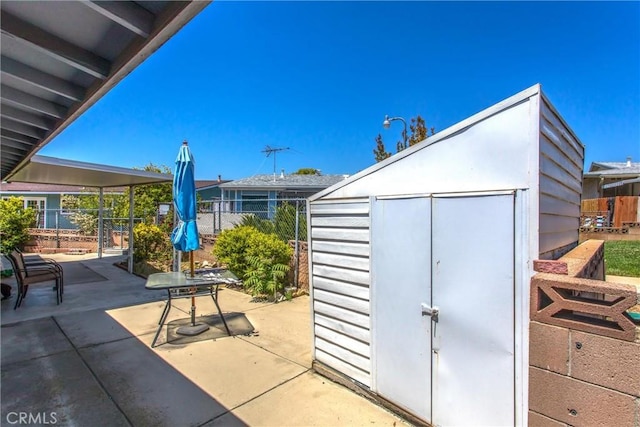 view of shed with fence