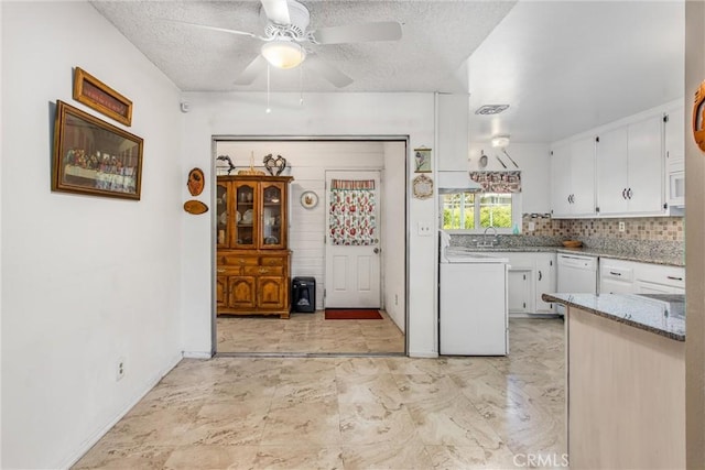 kitchen featuring a ceiling fan, white cabinetry, a textured ceiling, and white appliances