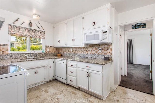 kitchen featuring a sink, white appliances, white cabinetry, and marble finish floor