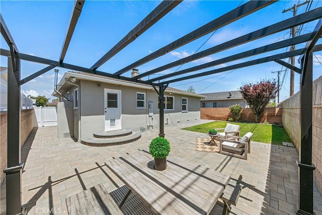 view of patio / terrace with a fenced backyard and a pergola