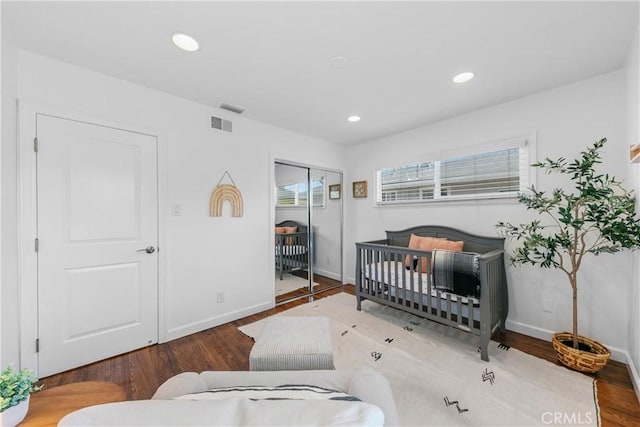 bedroom with baseboards, a closet, recessed lighting, and wood finished floors