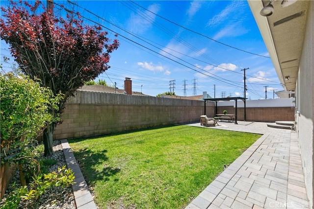 view of yard with a patio and a fenced backyard
