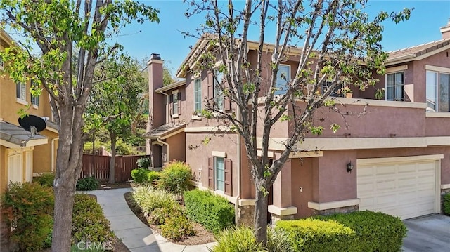 exterior space featuring fence, a chimney, and stucco siding