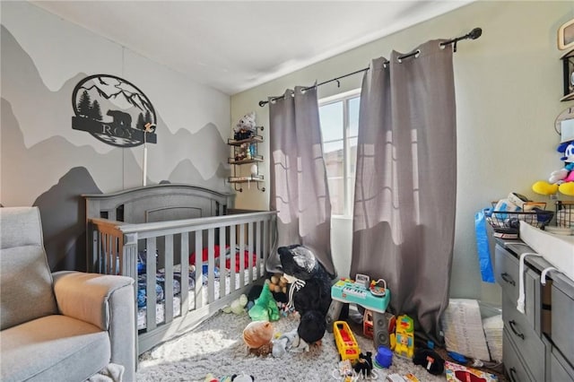 bedroom featuring a crib
