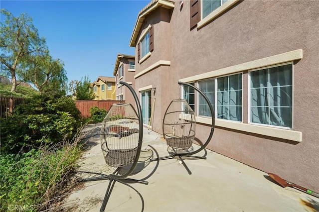 view of patio featuring fence