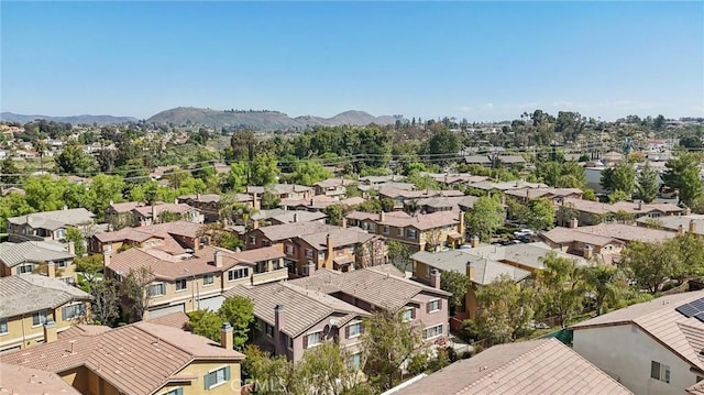 birds eye view of property featuring a mountain view and a residential view