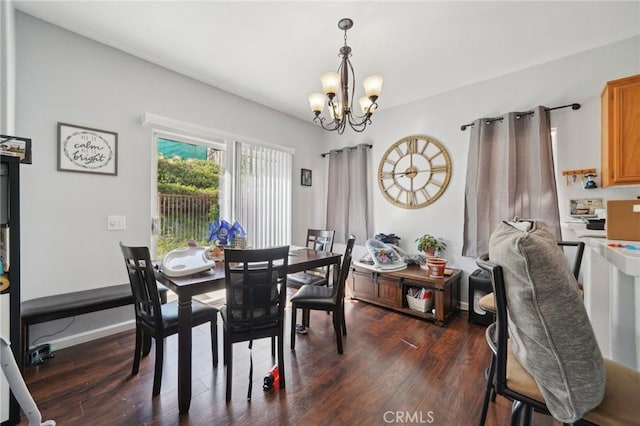 dining area featuring a chandelier and dark wood-type flooring