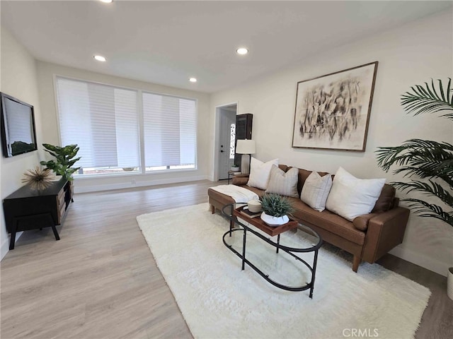 8611 Chapman Ave, Garden Grove, CA 92841 - living room featuring light wood-style flooring, baseboards, and recessed lighting