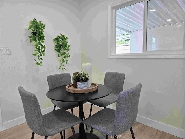 8611 Chapman Ave, Garden Grove, CA 92841 - dining area with baseboards and wood finished floors