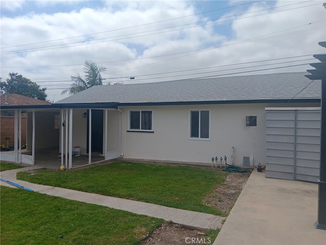8611 Chapman Ave, Garden Grove, CA 92841 - back of house with stucco siding, a shingled roof, and a yard