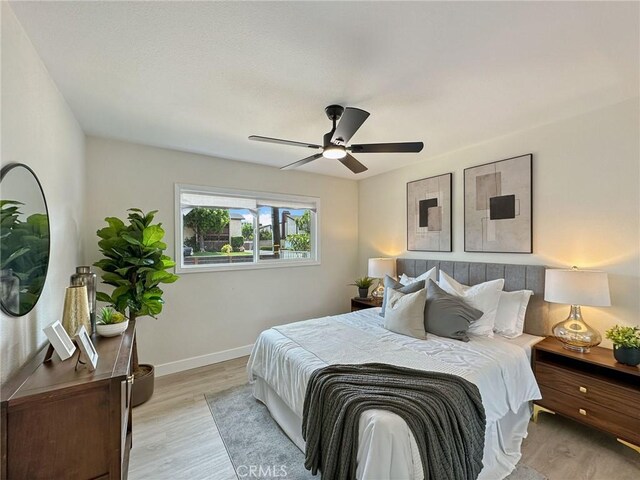 8611 Chapman Ave, Garden Grove, CA 92841 - bedroom featuring light wood-style floors, baseboards, and a ceiling fan