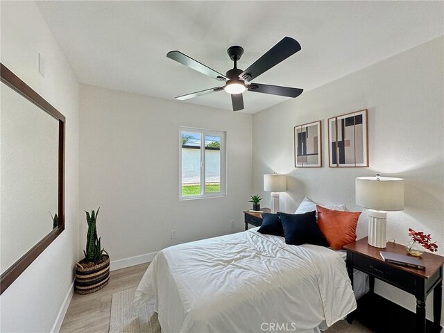 8611 Chapman Ave, Garden Grove, CA 92841 - bedroom with light wood-style flooring, baseboards, and ceiling fan
