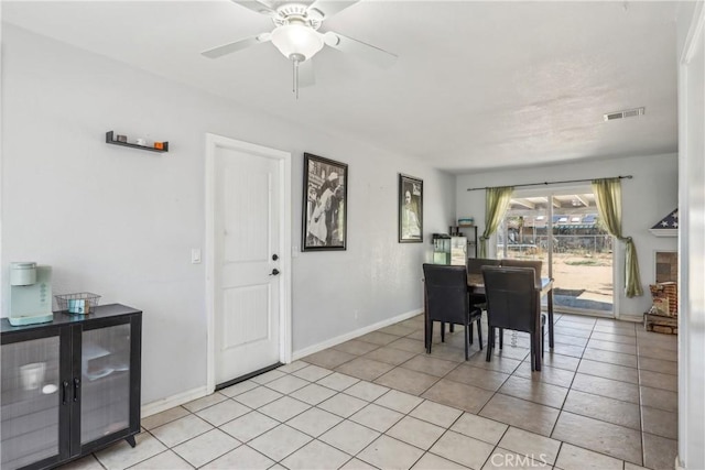 14544 Jelan Ave, Apple Valley, CA 92307 - dining room featuring light tile patterned floors, baseboards, ceiling fan, and visible vents