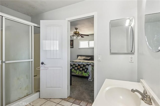 14544 Jelan Ave, Apple Valley, CA 92307 - ensuite bathroom with vanity, ensuite bathroom, tile patterned floors, a shower stall, and a ceiling fan