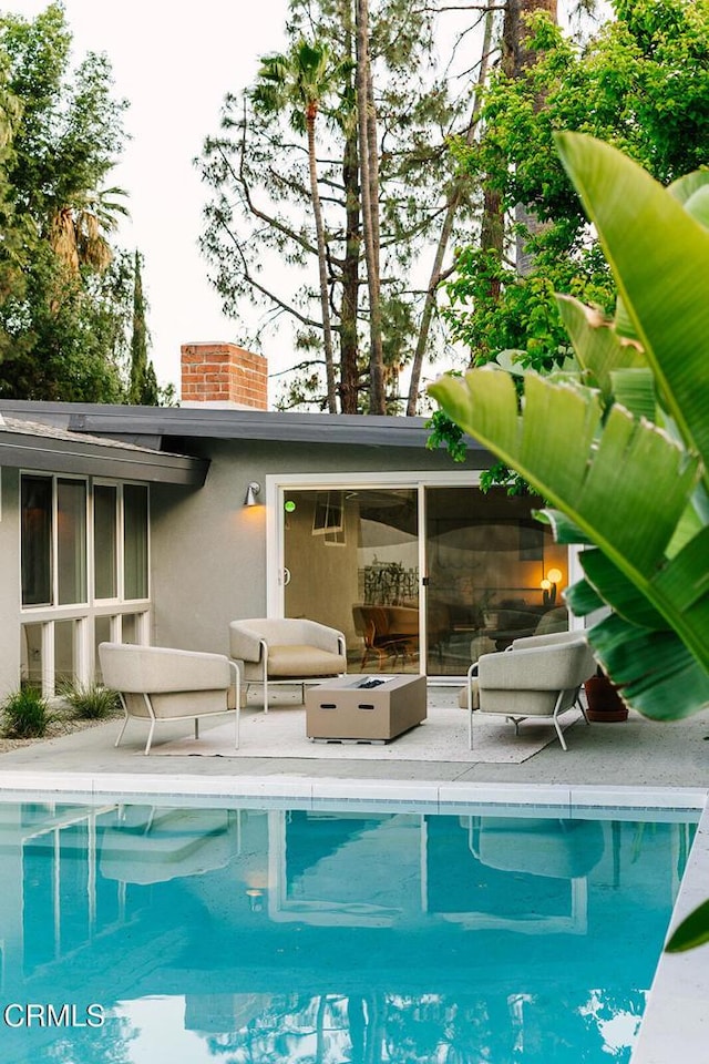 outdoor pool featuring a patio area