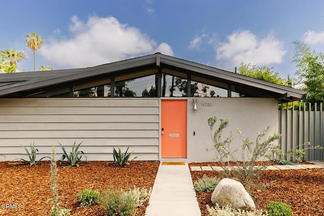 doorway to property with fence