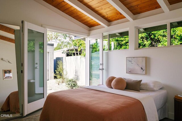 bedroom featuring lofted ceiling with beams, wooden ceiling, and access to exterior
