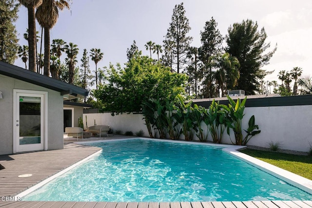 view of swimming pool featuring a fenced in pool and a fenced backyard