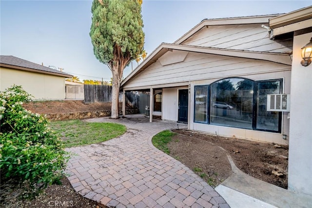 back of property with a patio and fence