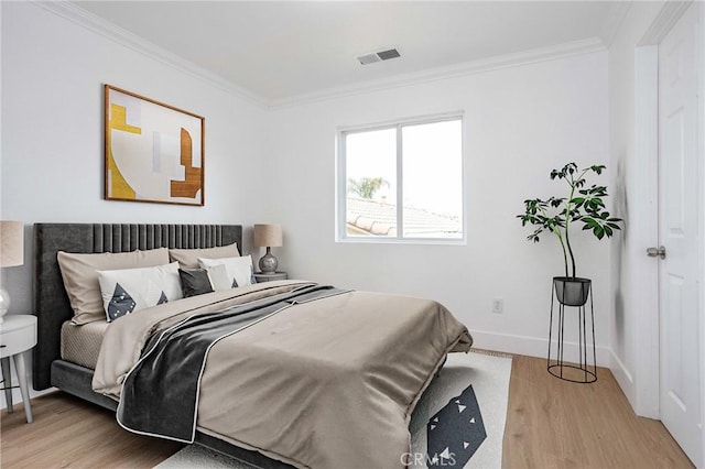 347 Beckes St, Wasco, CA 93280 - bedroom with crown molding, baseboards, light wood finished floors, and visible vents