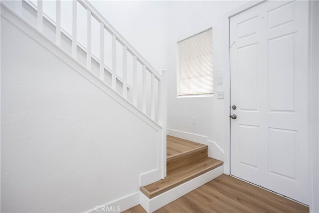 347 Beckes St, Wasco, CA 93280 - entrance foyer featuring stairway, baseboards, and wood finished floors