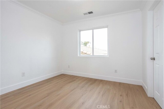 347 Beckes St, Wasco, CA 93280 - spare room with visible vents, ornamental molding, light wood-style flooring, and baseboards