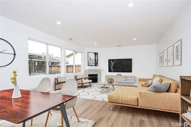 347 Beckes St, Wasco, CA 93280 - living area featuring recessed lighting, wood finished floors, and a fireplace