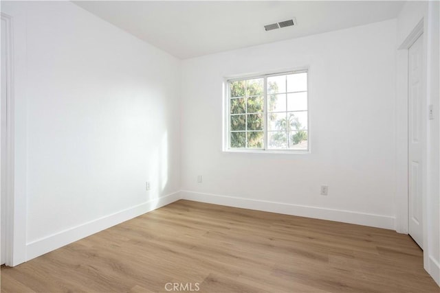 347 Beckes St, Wasco, CA 93280 - empty room with visible vents, baseboards, and light wood-style floors