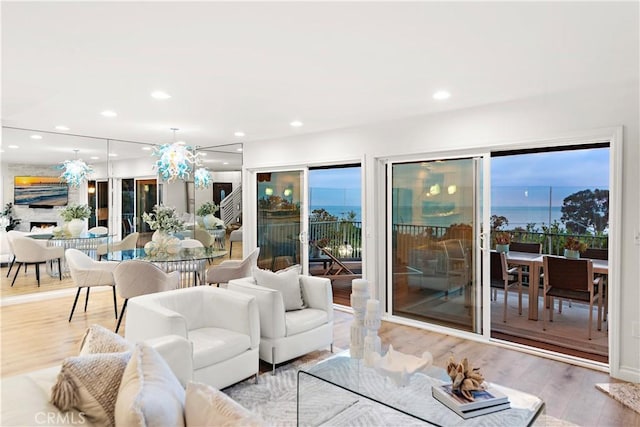 living area with recessed lighting and wood finished floors