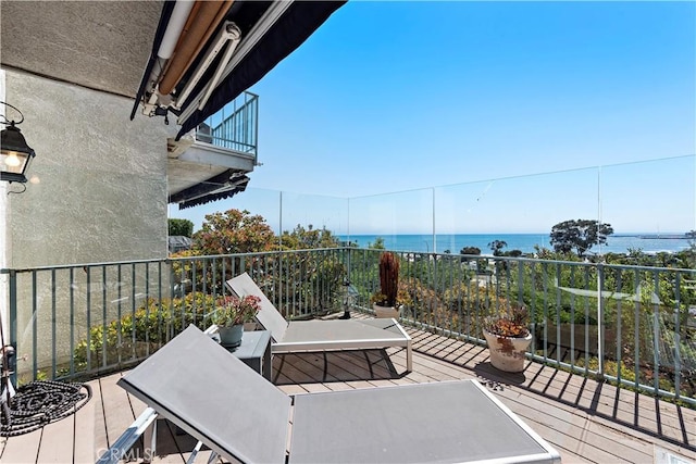 deck featuring a water view