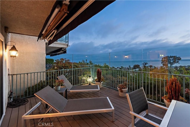 wooden deck with a water view