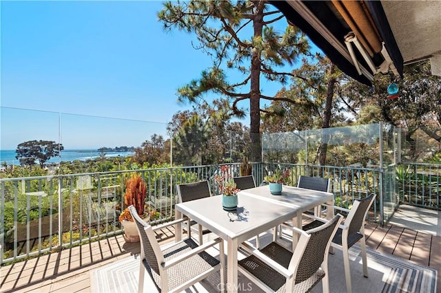 view of patio / terrace with a water view and outdoor dining area