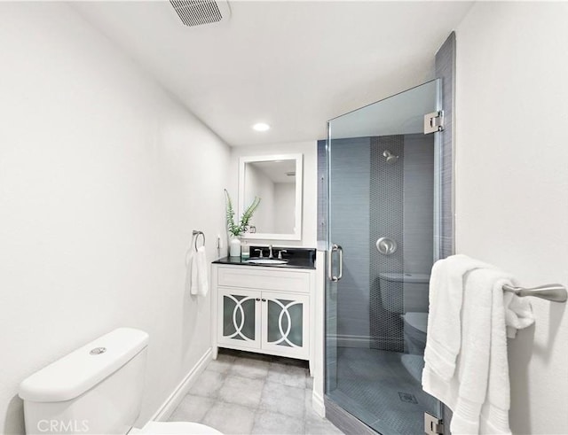 bathroom featuring visible vents, vanity, toilet, baseboards, and a shower stall