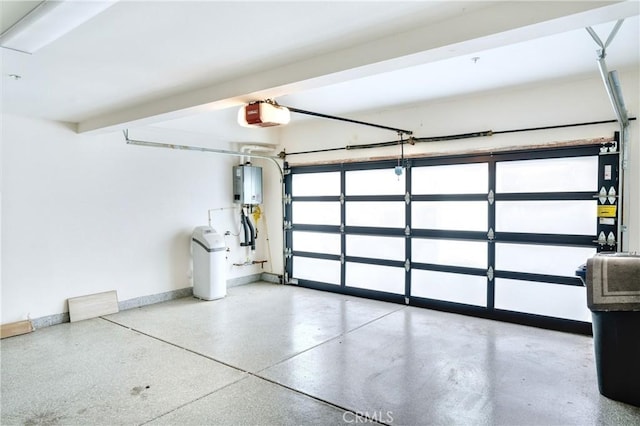 garage with tankless water heater and a garage door opener