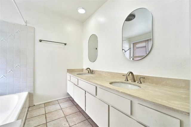 bathroom with double vanity, a sink, tile patterned flooring, and shower / bathing tub combination