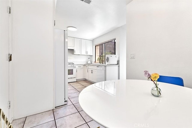 dining room featuring light tile patterned floors
