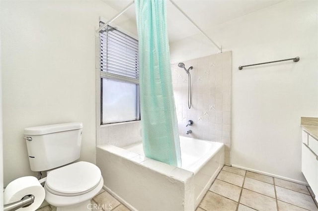 bathroom featuring vanity, tile patterned floors, shower / bath combo, and toilet