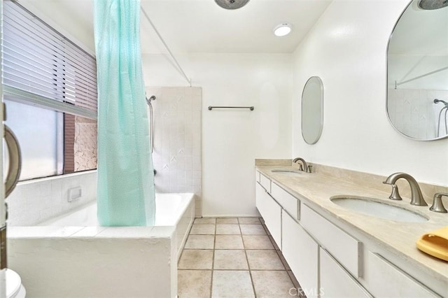 full bathroom featuring double vanity, a sink, tile patterned flooring, and shower / tub combo