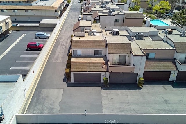 birds eye view of property with a residential view