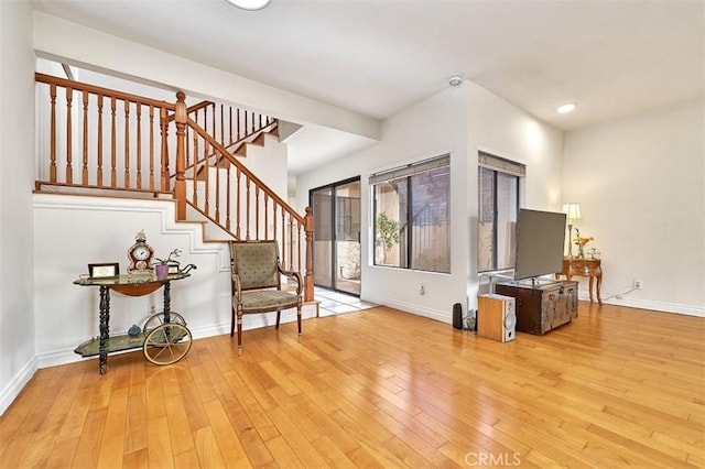 entryway featuring stairs, recessed lighting, baseboards, and wood-type flooring