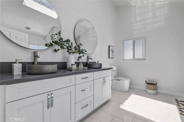 3118 Calle Grande, San Clemente, CA 92672 - full bathroom featuring a sink, double vanity, toilet, and baseboards