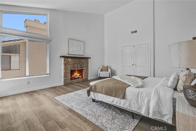 3118 Calle Grande, San Clemente, CA 92672 - bedroom with a fireplace, baseboards, high vaulted ceiling, and wood finished floors