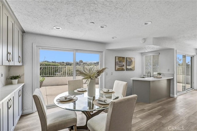 3118 Calle Grande, San Clemente, CA 92672 - dining area featuring a textured ceiling and light wood-style flooring