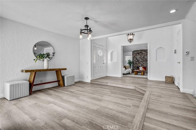 3118 Calle Grande, San Clemente, CA 92672 - entryway featuring radiator, an inviting chandelier, wood finished floors, and baseboards