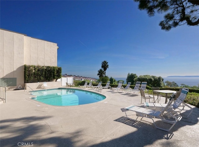 community pool with a patio