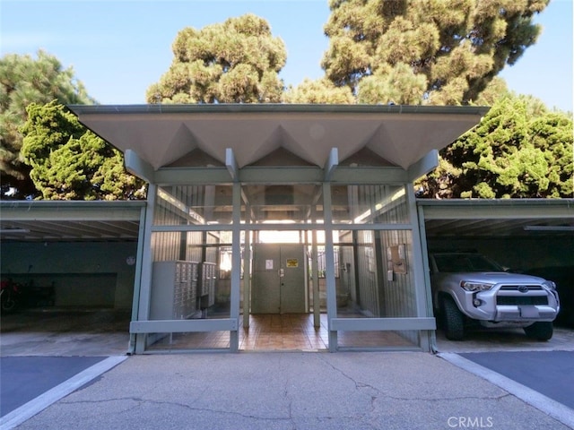 property entrance with covered parking